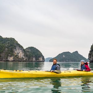 Kayaking between the majestic Halong Bay