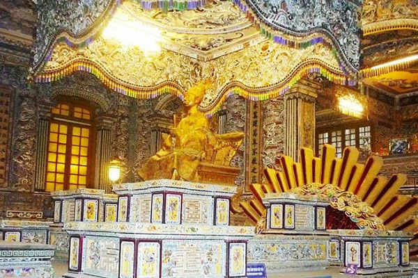 King statues sitting on the throne inside Imperial Tomb of Khai Dinh