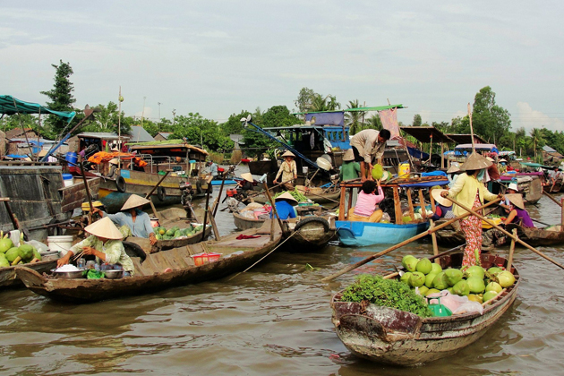 Boats with full of fruits and vegetable in Cai Rang Floating Market