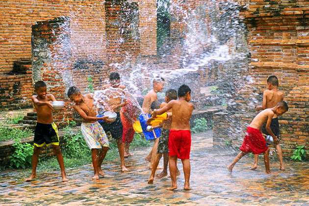 Cambodian children spray water to others in Chol Chnam Thmay, Cambodia
