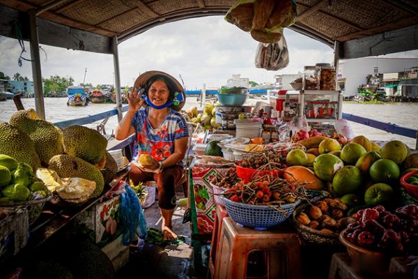 Old woman selling stuff on Cai Be Floating Market