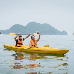 Couple Goes Kayaking on Halong Bay - Indochina Tour Packages