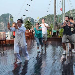 wake up and join tai chi class on halong bay cruise