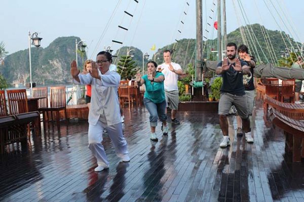 wake up and join tai chi class on halong bay cruise