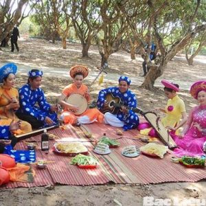 Artists perform traditional music folk song in fruit gadern mekong Delta