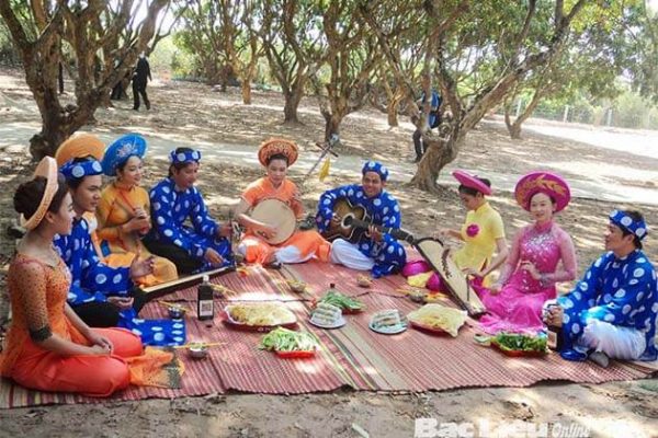 Artists perform traditional music folk song in fruit gadern mekong Delta