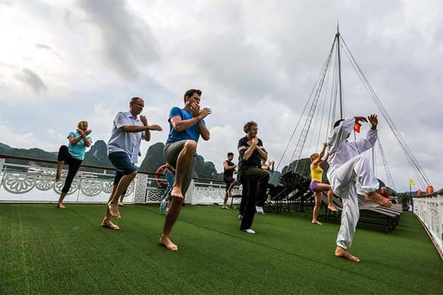 Tai Chi Exercises on Halong Bay Vietnam Laos Tour