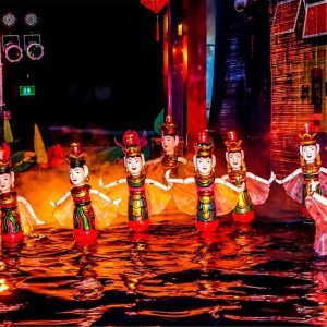 watching water puppet show in vietnam laos tour 11 days