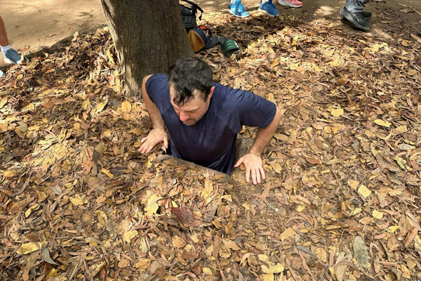 Exploring historic Cu Chi Tunnels during vietnam tour itinerary 12 days