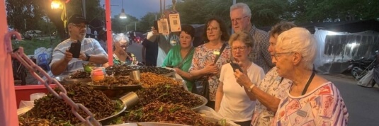 Explore the famous Phnom Penh night market during Indochina tours