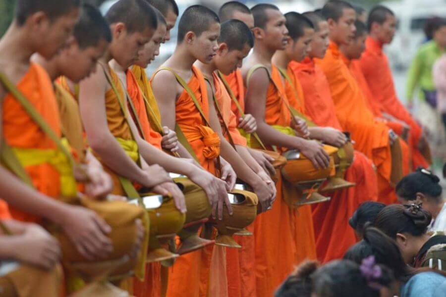 Tak Bat in Vietnam Laos tour packages